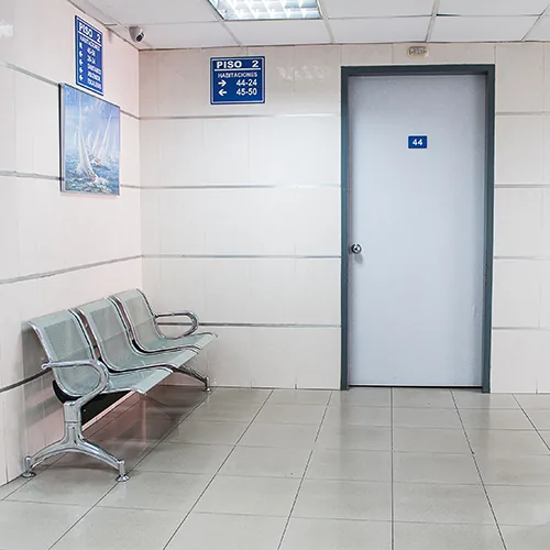 Hospital corridor with a flush door